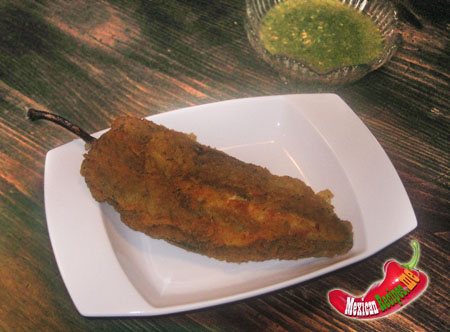 A breaded and stuffed Poblano Chile