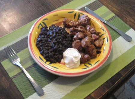 Carnitas michoacan plate with mexican black beans